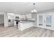 Modern kitchen with white cabinets, granite countertops, and stainless steel appliances at 2809 Ne 43Rd Rd, Ocala, FL 34470