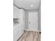 Bright laundry room with white cabinets and matching washer and dryer at 2809 Ne 43Rd Rd, Ocala, FL 34470