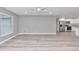 Living room with light gray walls, vinyl flooring, and a ceiling fan at 2809 Ne 43Rd Rd, Ocala, FL 34470