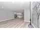Open concept living area with hardwood floors and a view into the kitchen at 2809 Ne 43Rd Rd, Ocala, FL 34470