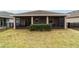 Home exterior with screened porch and grassy backyard at 3977 Nw 46Th Ter, Ocala, FL 34482