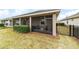 Screened porch with fenced backyard and manicured lawn at 3977 Nw 46Th Ter, Ocala, FL 34482