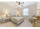 Bedroom with floral bedding, nightstands, and ceiling fan at 3977 Nw 46Th Ter, Ocala, FL 34482