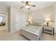 Bedroom with floral bedding, nightstands and ceiling fan at 3977 Nw 46Th Ter, Ocala, FL 34482
