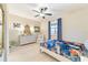 Bedroom with ceiling fan, white dresser and full bed at 3977 Nw 46Th Ter, Ocala, FL 34482