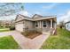 One-story home with stone accents and a welcoming front porch at 3977 Nw 46Th Ter, Ocala, FL 34482