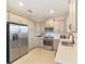 Modern kitchen with stainless steel appliances and neutral cabinets at 3977 Nw 46Th Ter, Ocala, FL 34482