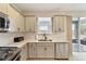 Modern kitchen features stainless steel appliances and light beige cabinets at 3977 Nw 46Th Ter, Ocala, FL 34482