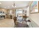 Eat-in kitchen with stainless steel appliances and glass dining table at 3977 Nw 46Th Ter, Ocala, FL 34482