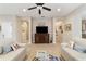 Living area with two sofas, a media cabinet, and access to laundry at 3977 Nw 46Th Ter, Ocala, FL 34482
