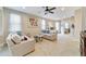 Living room with neutral decor, comfortable seating and large windows at 3977 Nw 46Th Ter, Ocala, FL 34482