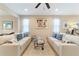 Spacious living room featuring two sofas and a glass-top coffee table at 3977 Nw 46Th Ter, Ocala, FL 34482