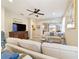 Open living room with comfortable sofas and a view to the kitchen at 3977 Nw 46Th Ter, Ocala, FL 34482