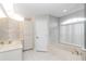Bathroom boasts a bathtub, double vanity, and updated flooring at 5370 Sw 85Th Ln, Ocala, FL 34476