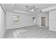 Primary bedroom with tile floors and two windows at 5370 Sw 85Th Ln, Ocala, FL 34476