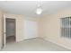 Bright bedroom with ceiling fan and double doors at 5370 Sw 85Th Ln, Ocala, FL 34476