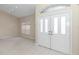 Bright entryway with double doors and tile flooring at 5370 Sw 85Th Ln, Ocala, FL 34476