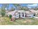 Single-story home with a landscaped yard and attached garage at 5370 Sw 85Th Ln, Ocala, FL 34476