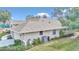 Rear view of the house showcasing the garage and landscaping at 5370 Sw 85Th Ln, Ocala, FL 34476