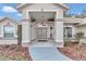 Front entry with double doors and a covered porch at 5370 Sw 85Th Ln, Ocala, FL 34476