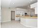 Kitchen with light cabinets, breakfast bar, and tile flooring at 5370 Sw 85Th Ln, Ocala, FL 34476