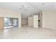 Open living room with high ceilings, tile floors, and view into kitchen at 5370 Sw 85Th Ln, Ocala, FL 34476