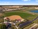 Aerial view of community baseball field with parking and landscaping at 7732 Sw 94Th Cir, Ocala, FL 34481