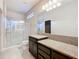 Bathroom with shower, toilet, granite countertop, and dark brown vanity at 7732 Sw 94Th Cir, Ocala, FL 34481
