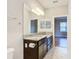 Double vanity bathroom with granite countertop and view of bedroom at 7732 Sw 94Th Cir, Ocala, FL 34481