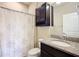 Bathroom with shower, toilet, vanity, and floral shower curtain at 7732 Sw 94Th Cir, Ocala, FL 34481