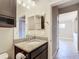 Small bathroom with vanity, granite countertop and view of living area at 7732 Sw 94Th Cir, Ocala, FL 34481