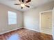 Bright bedroom with wood flooring, ceiling fan, and window blinds at 7732 Sw 94Th Cir, Ocala, FL 34481