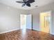 Spacious bedroom with wood flooring and ceiling fan at 7732 Sw 94Th Cir, Ocala, FL 34481