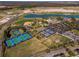 Aerial view of community amenities including tennis, pickleball, and baseball at 7732 Sw 94Th Cir, Ocala, FL 34481