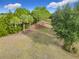 Lush green community lawn with palm trees and lush foliage at 7732 Sw 94Th Cir, Ocala, FL 34481