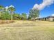 Landscaped community lawn with mature trees and shrubs at 7732 Sw 94Th Cir, Ocala, FL 34481
