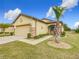 One-story house with a two-car garage and palm tree at 7732 Sw 94Th Cir, Ocala, FL 34481