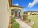 House exterior showcasing walkway to screened porch at 7732 Sw 94Th Cir, Ocala, FL 34481