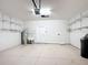 Garage with utility sink, shelving, and water softener at 7732 Sw 94Th Cir, Ocala, FL 34481