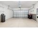 Two-car garage with built-in shelving and water softener at 7732 Sw 94Th Cir, Ocala, FL 34481
