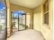 Cozy screened porch with tiled flooring at 7732 Sw 94Th Cir, Ocala, FL 34481