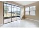 Sunroom featuring glass sliders and view of backyard at 7732 Sw 94Th Cir, Ocala, FL 34481