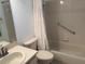 Clean bathroom with a shower/tub combo and neutral tile at 9117 Sw 93Rd Cir, Ocala, FL 34481