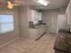 Modern kitchen with granite countertops and white cabinets at 9117 Sw 93Rd Cir, Ocala, FL 34481