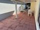 Covered patio with table and chairs, ideal for outdoor dining at 9117 Sw 93Rd Cir, Ocala, FL 34481
