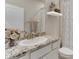 Clean bathroom with granite countertop and updated fixtures at 9287 Sw 60Th Court Rd, Ocala, FL 34476