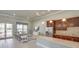Community room with kitchen, seating area, and large screen TV at 9287 Sw 60Th Court Rd, Ocala, FL 34476
