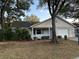 Brick ranch home with carport and mature landscaping at 9529 Sw 85Th Ave # A, Ocala, FL 34481