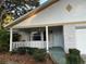 White brick home with a covered front porch at 9529 Sw 85Th Ave # A, Ocala, FL 34481