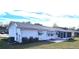 Rear view of a house showcasing a screened porch and AC unit at 11190 Sw 75Th Ter, Ocala, FL 34476